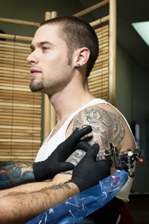 Guy getting Tattoo on Arm